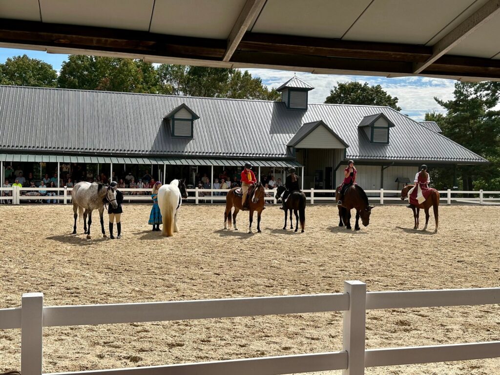 people riding a horse in Kentucky Horse Park